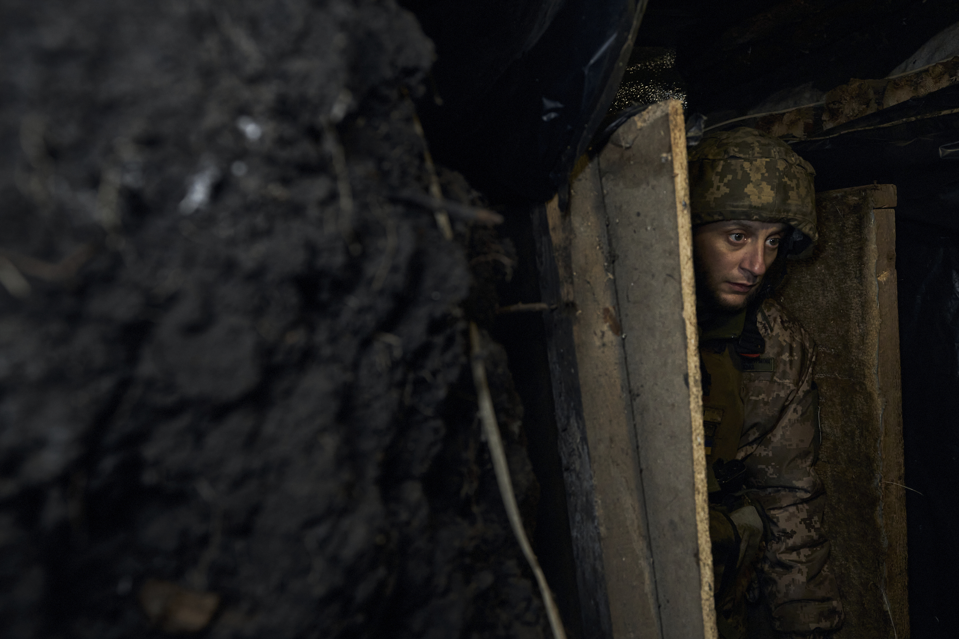 A Ukrainian soldier walks at a frontline position near Maryinka, Donetsk region, Ukraine, Friday, Dec. 23, 2022. (AP Photo/Libkos)