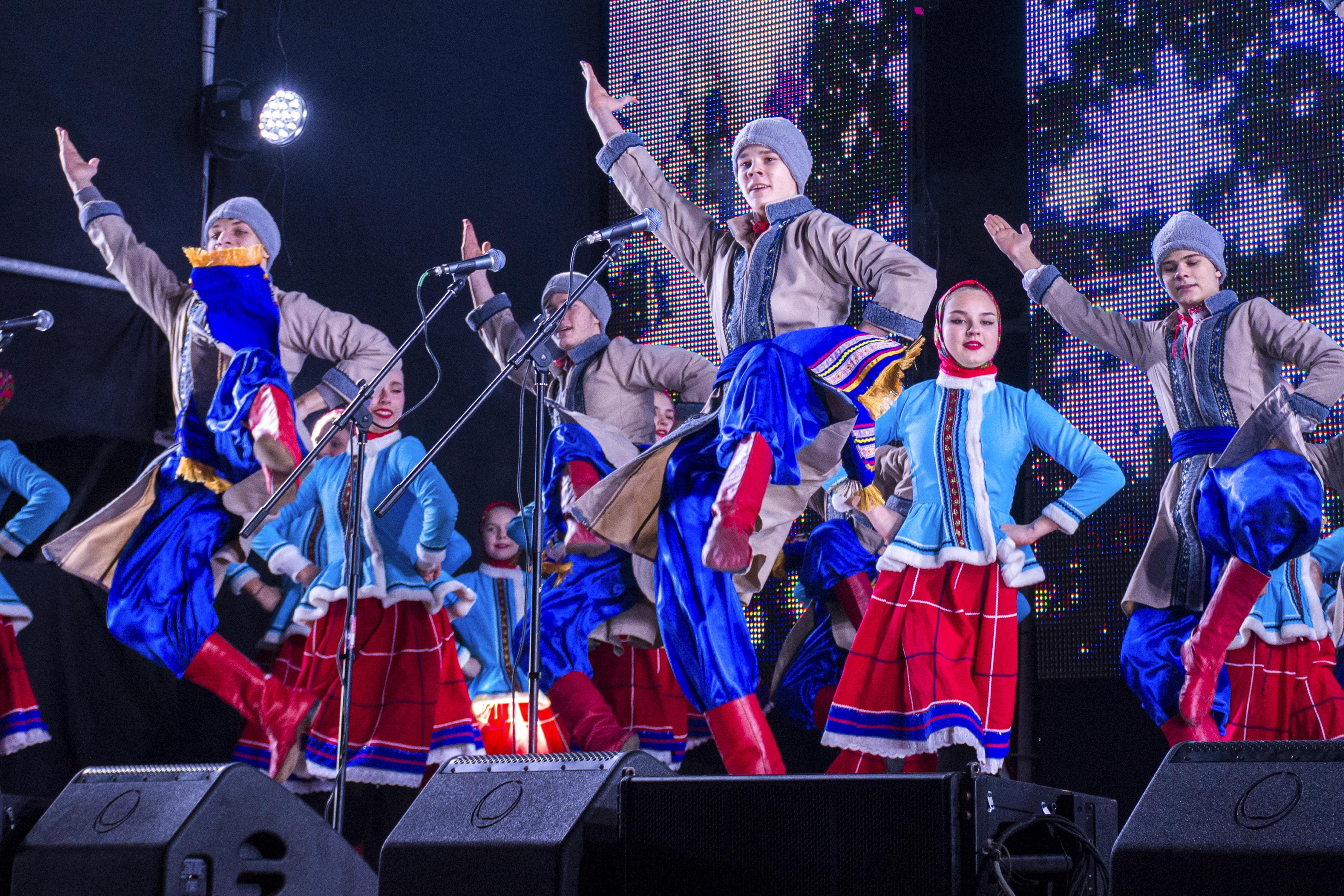Young artists perform as people gather at the Christmas tree decorated for Christmas and the New Year festivities in Luhansk, the capital of Russian-controlled Luhansk region, eastern Ukraine, Friday, Dec. 23, 2022. (AP Photo)