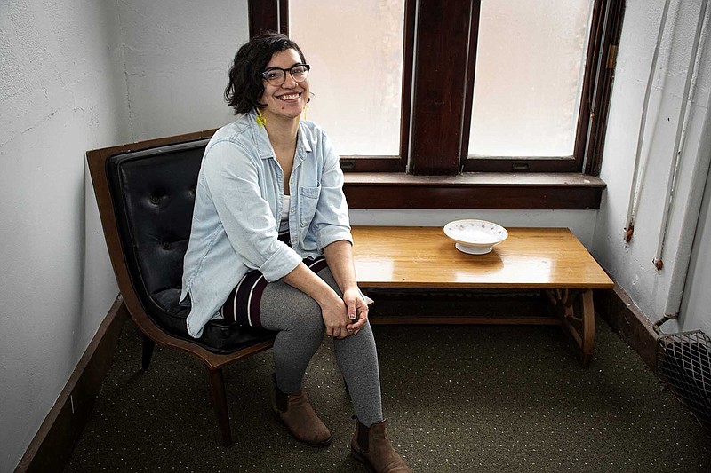 Laura Fuentes, who serves as archivist for St. Joseph Center of Arkansas, sits in a tiny room that served as a bedroom for young girls thinking about becoming nuns.
(Arkansas Democrat-Gazette/Cary Jenkins)