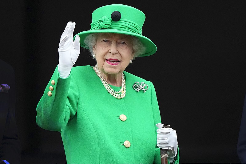 Britain's Queen Elizabeth II waves to the crowd during the Platinum Jubilee Pageant at the Buckingham Palace in London, June 5, 2022, on the last of four days of celebrations to mark the Platinum Jubilee. Queen Elizabeth II's death in September 2022 was arguably the most high-profile death this year. In her 70 years on the British throne, she helped modernize the monarchy across decades of enormous social change, royal marriages and births, and family scandals. For most Britons, she was the only monarch they had ever known. (AP Photo/Frank Augstein, Pool)