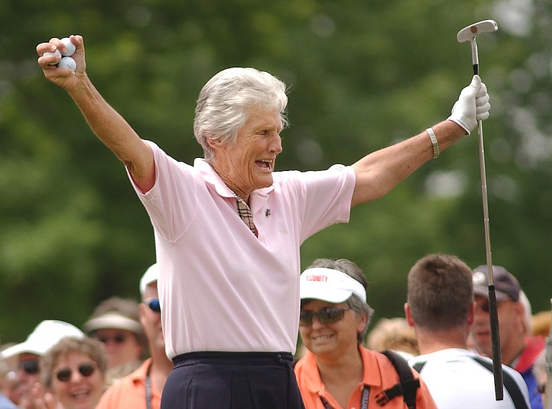 Kathy Whitworth responds to the crowd as she prepares to tee off during the Tournament of Champions golf tournament at Locust Hill Country Club in Pittsford, N.Y. on June 20, 2006. Former LPGA Tour player Whitworth, whose 88 victories are the most by any golfer on a single professional tour, died on Saturday, Dec. 24, 2022, night, her longtime partner said. She was 83. (Carlos Ortiz/Democrat & Chronicle via AP, File)