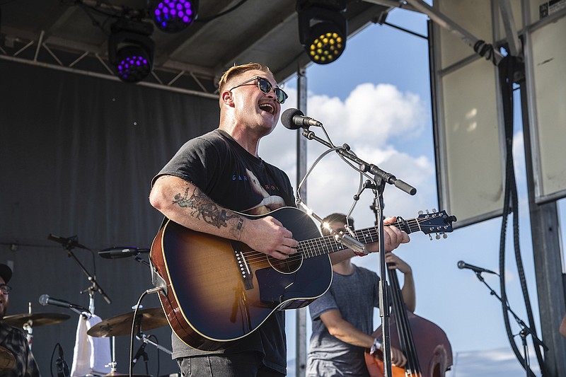 Zach Bryan performs at the Railbird Music Festival on Sunday, Aug. 29, 2021, in Lexington, Ky. The chorus against Ticketmaster's contentious concert pricing practices is growing, numbering among them Zach Bryan and friends.The country music artist dropped a live album, “All My Homies Hate Ticketmaster,” on Sunday, Dec. 25, 2022. With it came a statement posted to social media in which he decried “a massive issue with fair ticket prices to live shows lately.” (Photo by Amy Harris/Invision/AP, File)