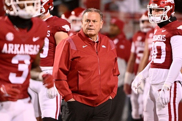 Arkansas coach Sam Pittman watches his team warm up before playing Mississippi during an NCAA college football game Saturday, Nov. 19, 2022, in Fayetteville, Ark. (AP Photo/Michael Woods) Arkansas coach Sam Pittman watches his team warm up before playing Mississippi during an NCAA college football game Saturday, Nov. 19, 2022, in Fayetteville, Ark. (AP Photo/Michael Woods)