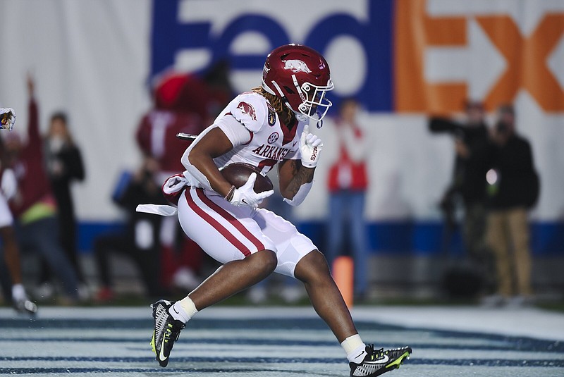 Arkansas tight end Ty Washington caught a 17-yard touchdown pass from quarterback KJ Jefferson during the first quarter Wednesday against Kansas in the Liberty Bowl in Memphis. The touchdown was part of the Razorbacks’ 24-point first quarter, the highest in a bowl game in program history.
(NWA Democrat-Gazette/Charlie Kaijo)