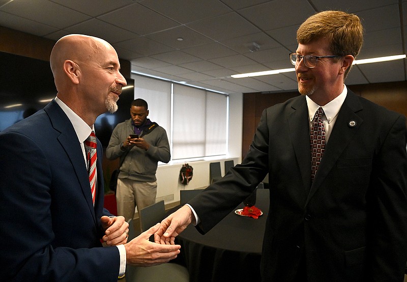 Jacob Oliva (left), chancellor of the division of public schools for the Florida Department of Education, talks with outgoing Education Secretary Johnny Key, who Oliva has been nominated to replace. Key declined to comment Thursday after Gov.-elect Sarah Huckabee Sanders made the announcement. In an email to his staff, he said the job had been “the highlight of my nearly 30 years of public service” and wished Oliva success.
(Arkansas Democrat-Gazette/Stephen Swofford)