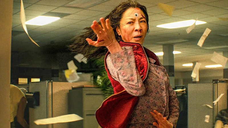 One of the infinite incarnations of Evelyn Wang (Michelle Yeoh) fights to save the multiverse in “Everything Everywhere All at Once,” an absurd adventure comedy by the directing team “The Daniels” (Dan Kwan and Daniel Scheinert) that’s popping up on many critics’ year-end Top 10 lists.