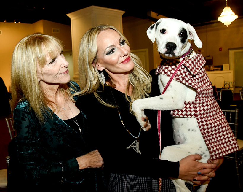 Sally Bourgeois,left, and Brooke Bourgeois, PPC executive director, holding PPC dog Licorice, attend Pet Placement Center's Tails at Twilight fundraiser on Thursday, Nov. 10, 2022 at Restoration Southside. Licorice got adopted shortly after the event by someone who met her there. / Photo by Angela Foster