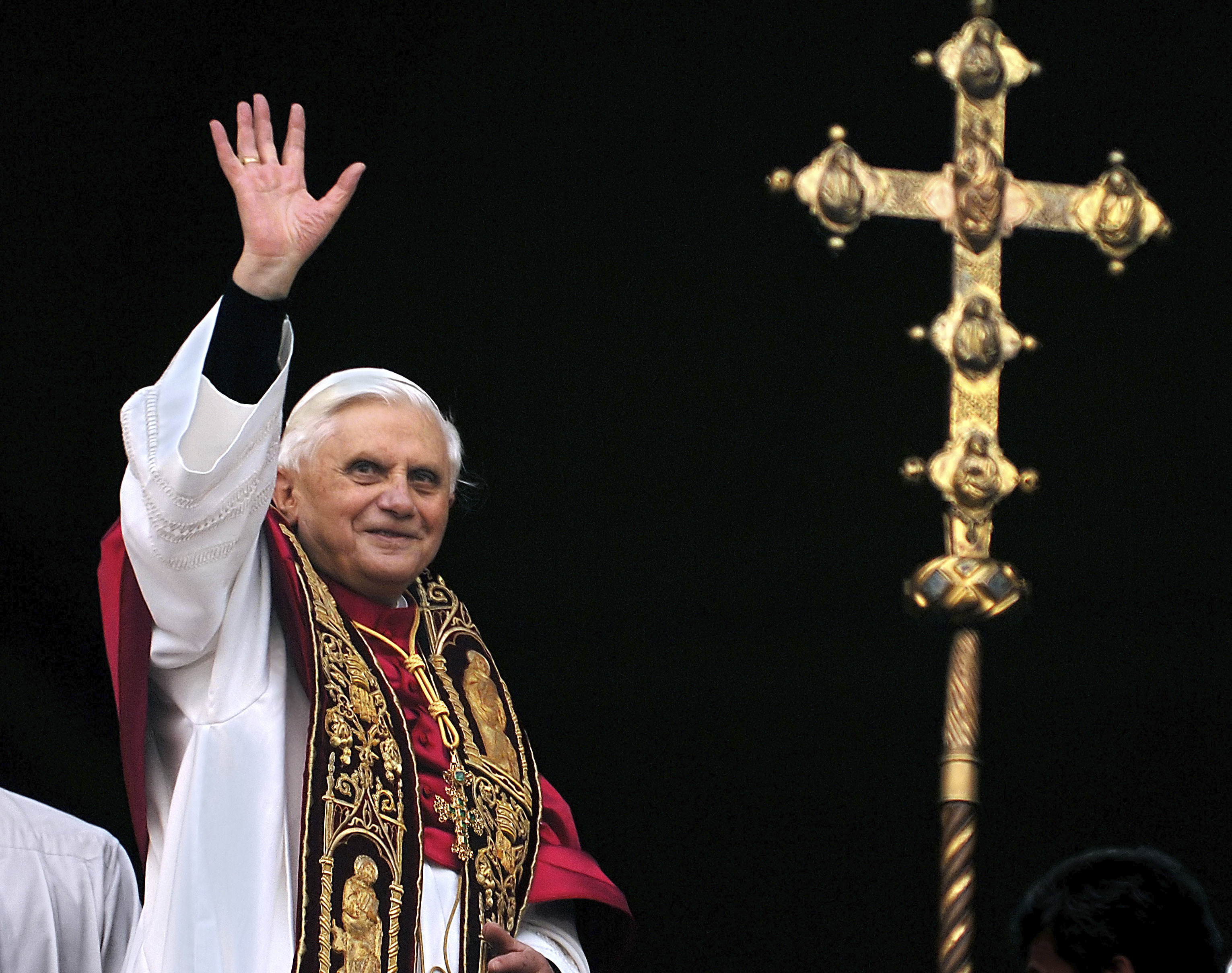 FILE - Pope Benedict XVI greets the crowd from the central balcony of St. Peter's Basilica at the Vatican, on April 19, 2005, soon after his election. When Cardinal Joseph Ratzinger became Pope Benedict XVI and was thrust into the footsteps of his beloved and charismatic predecessor, he said he felt a guillotine had come down on him. The Vatican announced Saturday Dec. 31, 2022 that Benedict, the former Joseph Ratzinger, had died at age 95. (AP Photo/Domenico Stinellis, File)
