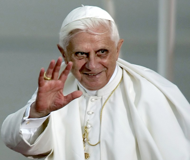 FILE - Pope Benedict XVI waves during the farewell ceremony at Cologne airport, Germany, on Aug. 21, 2005.  Pope Benedict XVI was on his first foreign trip as pontiff and took part in the World Youth Day 2005 in Cologne. When Cardinal Joseph Ratzinger became Pope Benedict XVI and was thrust into the footsteps of his beloved and charismatic predecessor, he said he felt a guillotine had come down on him. The Vatican announced Saturday Dec. 31, 2022 that Benedict, the former Joseph Ratzinger, had died at age 95. (AP Photo/Eckehard Schulz, File)