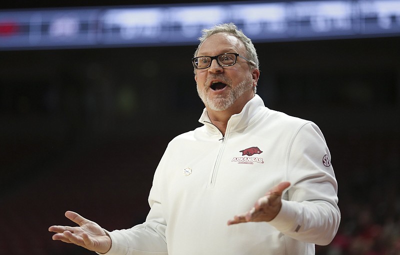 Arkansas head coach Mike Neighbors reacts, Sunday, January 23, 2022 during the second half of a basketball game at Walton Arena in Fayetteville. Check out nwaonline.com/220124Daily/ for today's photo gallery. .(NWA Democrat-Gazette/Charlie Kaijo)
