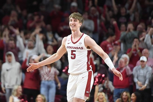 Arkansas guard Joseph Pinion celebrates Wednesday, Jan. 4, 2023, after hitting a three-point basket during the second half of the Razorbacks' 74-68 win over Missouri in Bud Walton Arena in Fayetteville.