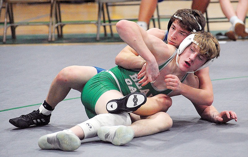 Jackson Finke of Blair Oaks looks to escape from Parker Jones of Capital City during Tuesday's dual at Blair Oaks High School in Wardsville. (Shaun Zimmerman/News Tribune)