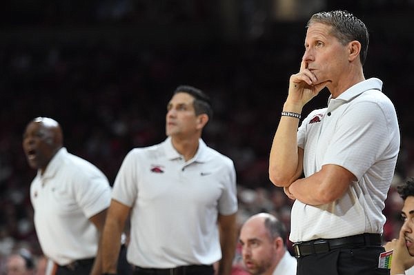 Arkansas coach Eric Musselman (right) watches Wednesday, Jan. 4, 2023, during the first half of play against Missouri in Bud Walton Arena in Fayetteville.