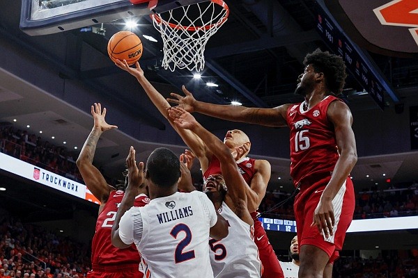 Arkansas guard Jordan Walsh tips in a rebound during the first half of a game against Auburn on Saturday, Jan. 7, 2023, in Auburn, Ala. (AP Photo/Butch Dill) Arkansas guard Jordan Walsh tips in a rebound during the first half of a game against Auburn on Saturday, Jan. 7, 2023, in Auburn, Ala. (AP Photo/Butch Dill)