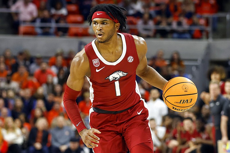 Arkansas guard Ricky Council IV dribbles the ball against Auburn during the first half of an NCAA college basketball game Saturday, Jan. 7, 2023, in Auburn, Ala. (AP Photo/Butch Dill)