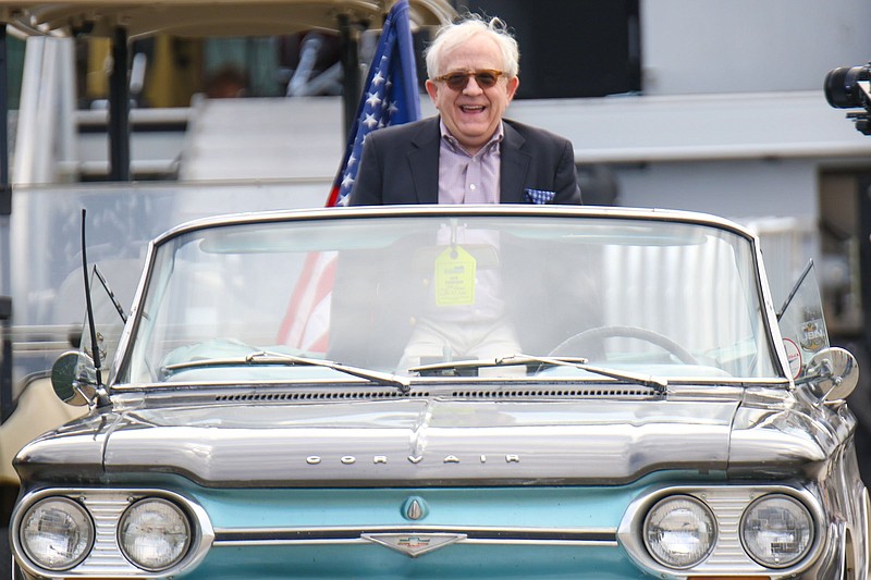 Staff photo by Olivia Ross / Leslie Jordan rides a Corvair around the Riverbend Festival to greet attendees on June 3, 2022.