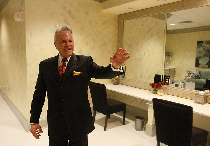 Staff file Photo / International Congress of Churches and Ministers CEO Michael Chitwood gestures to a mirror in the bridal suite of the International World Church as he gives a tour of the facility on Aug. 12, 2013.