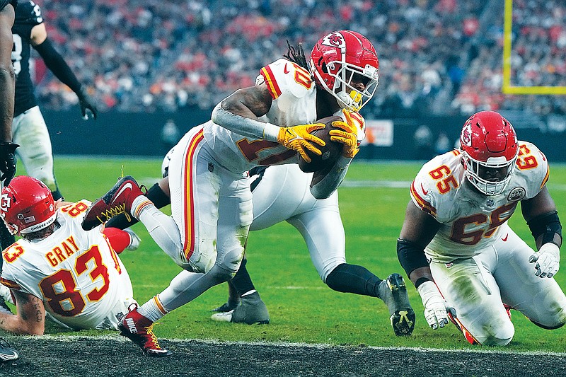Chiefs running back Isiah Pacheco scores a touchdown during Saturday’s win against the Raiders in Las Vegas. (Associated Press)