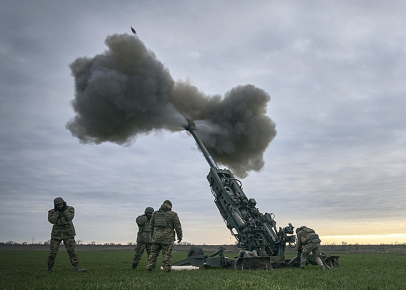 Ukrainian soldiers fire at Russian positions from a U.S.-supplied M777 howitzer in Kherson region, Ukraine, Jan. 9, 2023. (AP Photo/Libkos)