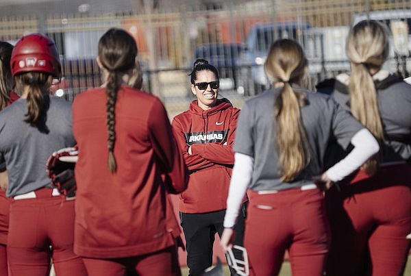 Arkansas coach Courtney Deifel (center) talks with players during a practice Sunday, Jan. 8, 2023, in Fayetteville.