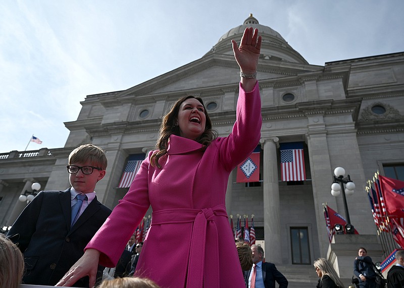 Sarah Huckabee Sanders, along with son Huck, waves to fans as she poses for photos following her inaugural address on the steps of the Arkansas State Capitol on Tuesday, Jan. 10, 2023. More photos at arkansasonline.com/111Sanders/..(Arkansas Democrat-Gazette/Stephen Swofford)