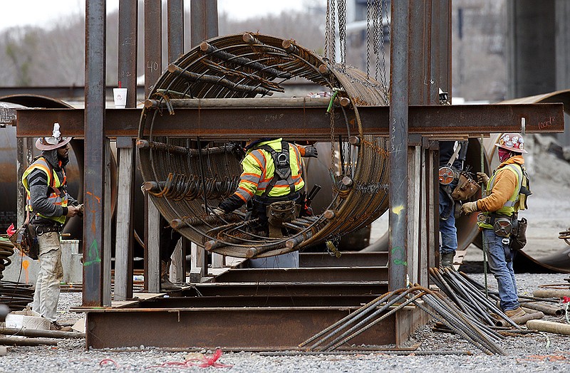 Construction workers in Little Rock build bridge supports to be used in the new Interstate 30 bridge as part of the 30 Crossing project on Thursday.
(Arkansas Democrat-Gazette/Thomas Metthe)