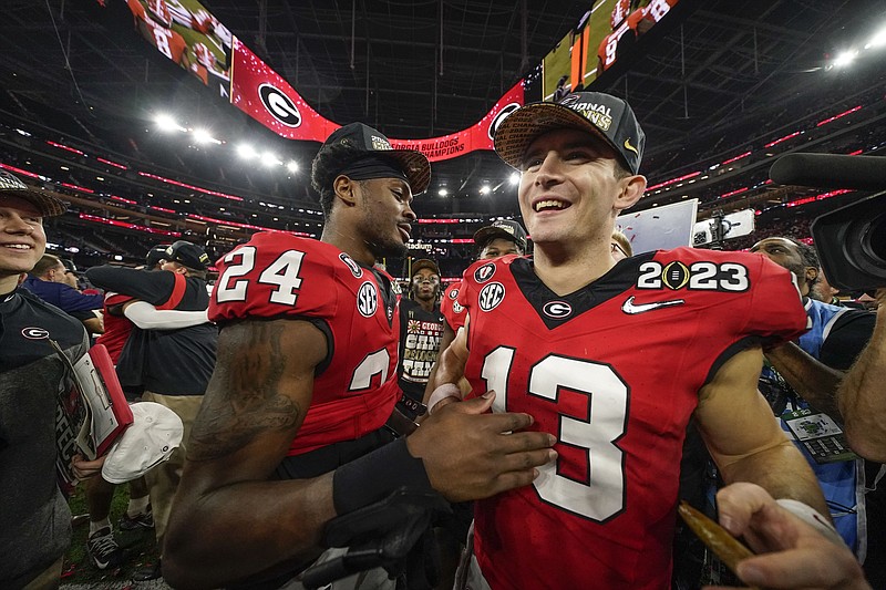 AP photo by Ashley Landis / Georgia quarterback Stetson Bennett (13) celebrates the Bulldogs' victory over TCU after Monday night's College Football Playoff title game in Inglewood, Calif. Georgia won 65-7.