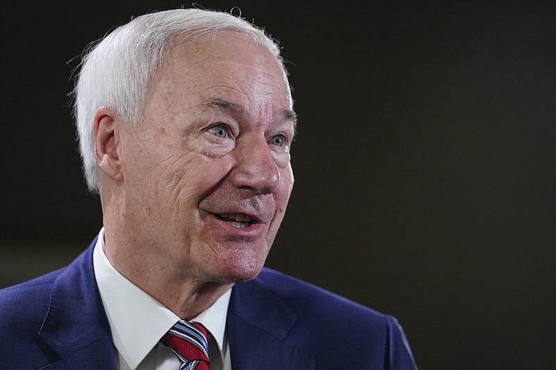 Arkansas Governor Asa Hutchinson responding during an interview with the Associated Press, Tuesday, Dec. 13, 2022 in Washington. (AP Photo/Pablo Martinez Monsivais)