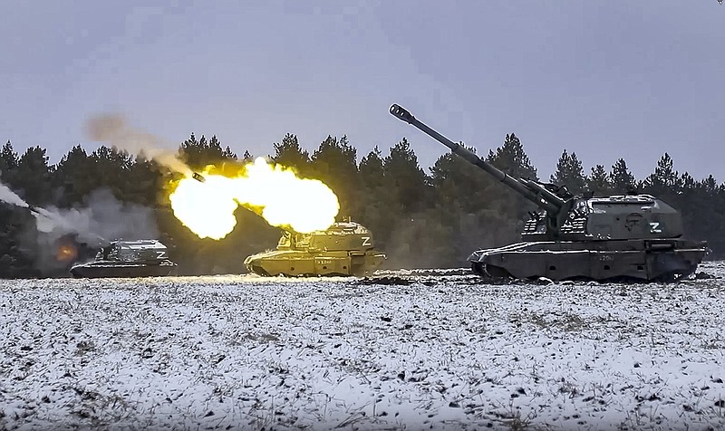 Russian self-propelled 152.4mm howitzers open fire from an undisclosed location inside Ukraine in this image from video released Friday.
(AP/Russian Defense Ministry Press Service)