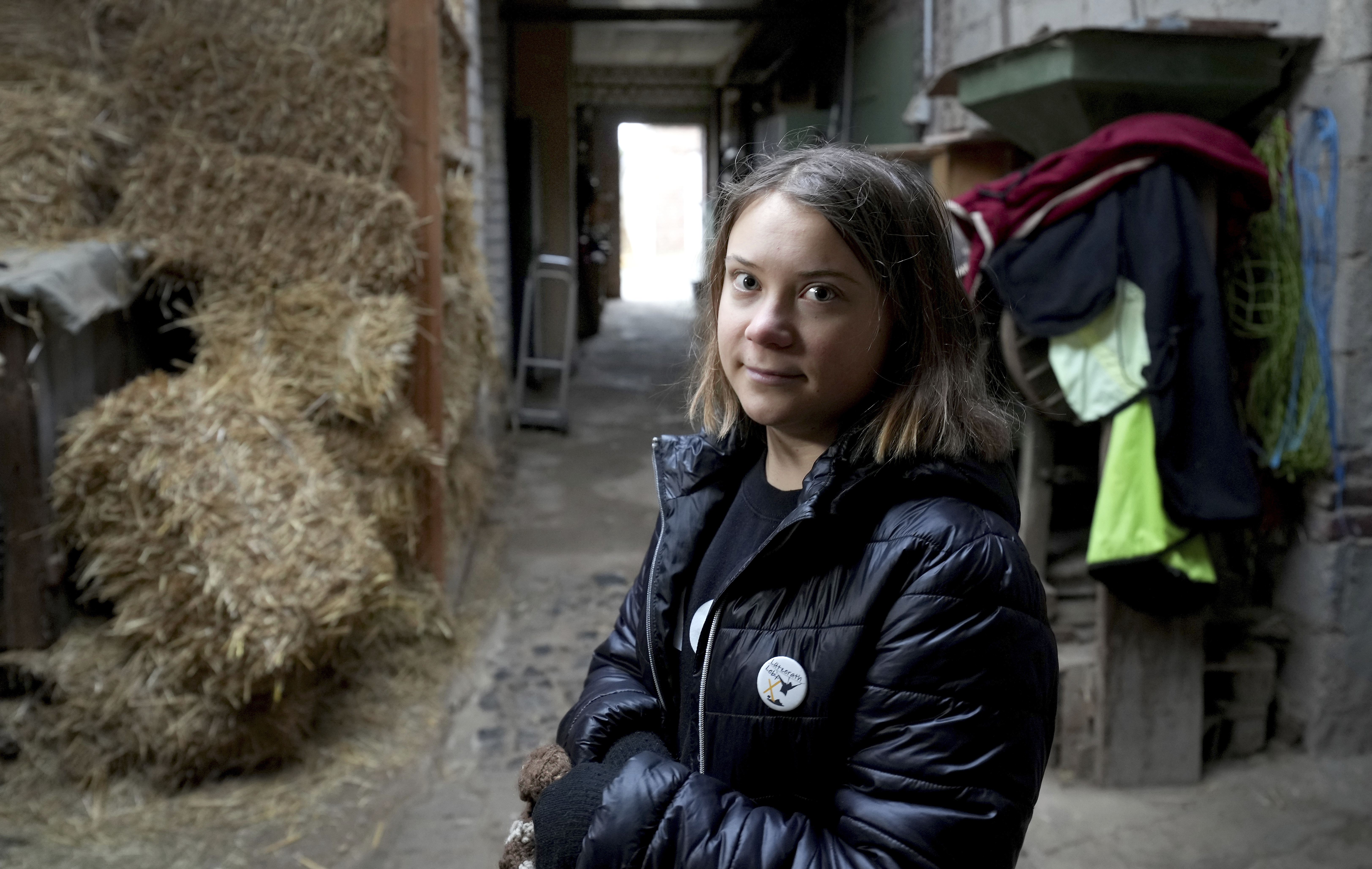Swedish climate campaigner Greta Thunberg looks on during an interview with the Associated Press Erkelenz, Germany, Saturday, Jan. 14, 2023. Ahead of a demonstration in which she will take part nearby on Saturday, Thunberg on Friday visited the tiny village of Luetzerath and took a look at the nearby Garzweiler open coal mine. (AP Photo/Michael Probst)