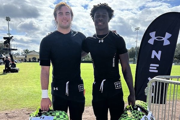 Arkansas freshman tight end Luke Hasz and running back signee Isaiah Augustave after an Under Armour All American practice.