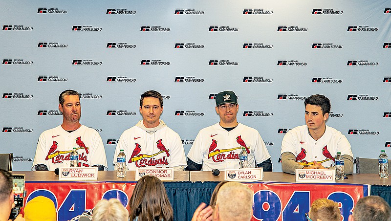 (From left) Ryan Ludwick, Connor Thomas, Dylan Carlson and Michael McGreevy sit in front of fans Friday during the Cardinal Caravan visit at the Missouri Farm Bureau. (Ken Barnes/News Tribune)