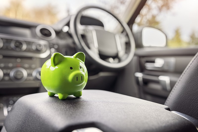 Car with piggy bank / Getty Images