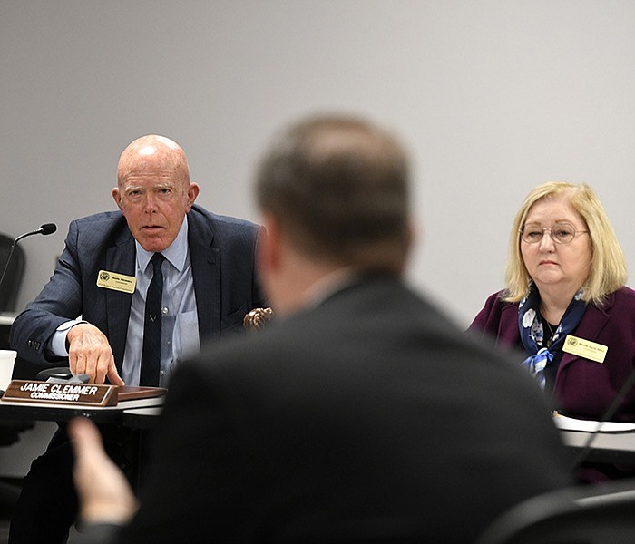 Commissioners Jamie Clemmer (left), and Bilenda Harris-Ritter listen as Chris Madison, legal counsel, lays out his case Wednesday in Little Rock at a Board of Election Commissioners meeting on complaints against Desha County for alleged election law violations.
(Arkansas Democrat-Gazette/Stephen Swofford)