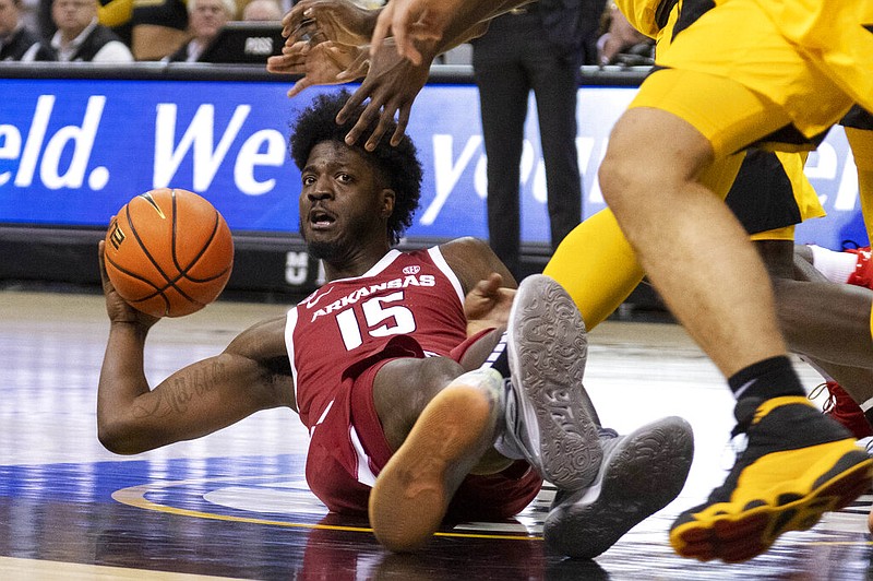 Arkansas' Makhi Mitchell, passes the ball during the first half of an NCAA college basketball game against Missouri Wednesday, Jan. 18, 2023, in Columbia, Mo. (AP Photo/L.G. Patterson)