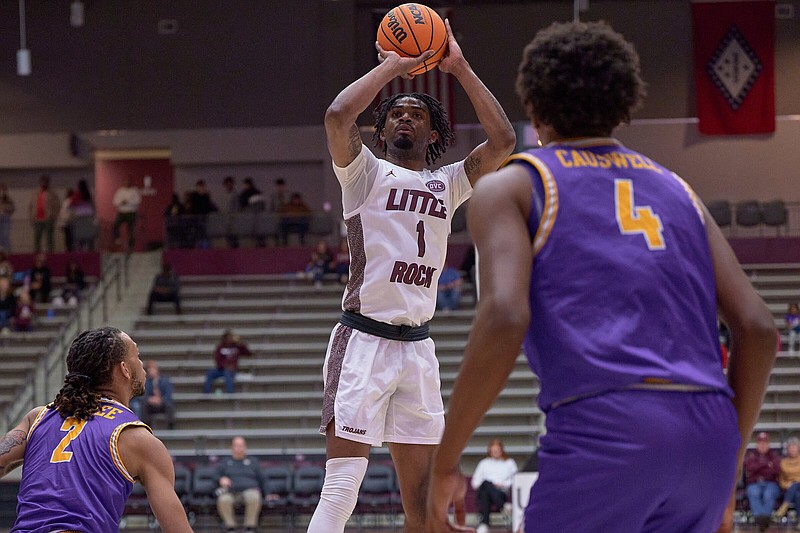UALR forward DeAntoni Gordon goes up for a shot while Tennessee Tech forward Jaylen Sebree (left) and center Nolan Causwell look on Thursday during the Trojans’ 77-75 loss to the Golden Eagles at the Jack Stephens Center. Gordon led UALR with 16 points.
(UALR Athletics/Mark Wagner)