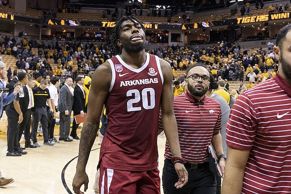Arkansas' Kamani Johnson walks off the court after the team's 79-76 loss to Missouri in an NCAA college basketball game Wednesday, Jan. 18, 2023, in Columbia, Mo. (AP Photo/L.G. Patterson)
