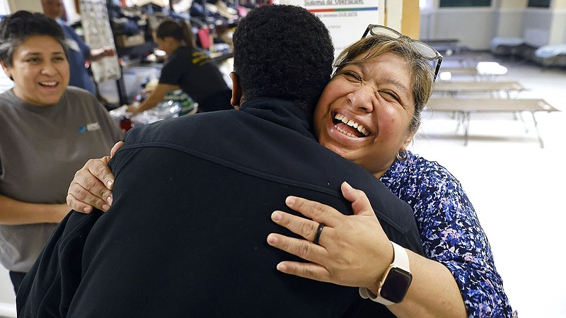 Associate Pastor Isabel Marquez greets a visitor to Oak Lawn United Methodist Church in Dallas. Marquez provides assistance to migrants who are seeking asylum in the United States.
(The Dallas Morning News/Tom Fox)