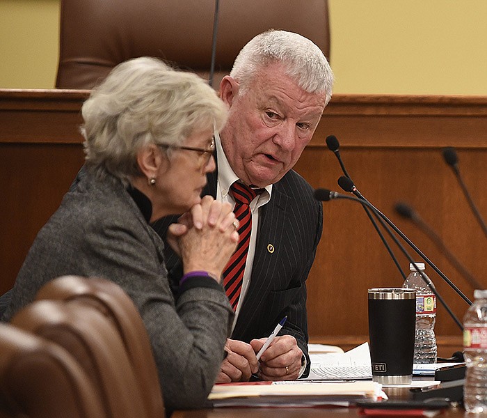 Annabelle Imber Tuck, chair of the Arkansas Independent Citizens Commission, confers with Tommy May, vice chair, during the panel’s meeting Friday at the state Capitol. May opposed the proposed raises, citing other states’ pay scales.
(Arkansas Democrat-Gazette/Staci Vandagriff)