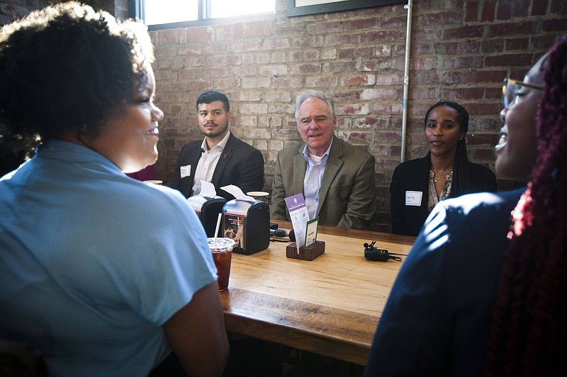 U.S. Sen. Tim Kaine, D-Va., (center) speaks during an economic roundtable Friday with young community leaders in Richmond, Va.
(AP/John C. Clark)