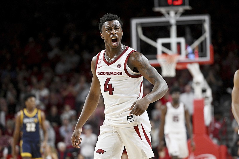 Arkansas guard Davonte Davis reacts after a UNC Greensboro turnover during the second half of an NCAA college basketball game, Tuesday, Dec. 6, 2022, in Fayetteville, Ark. (AP Photo/Michael Woods)