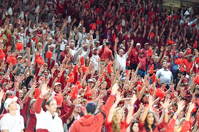 Arkansas fans call the hogs on Wednesday, Jan. 11, 2023, during the second half of the Alabama Crimson Tide’s 84-69 win over the Razorbacks at Bud Walton Arena in Fayetteville.