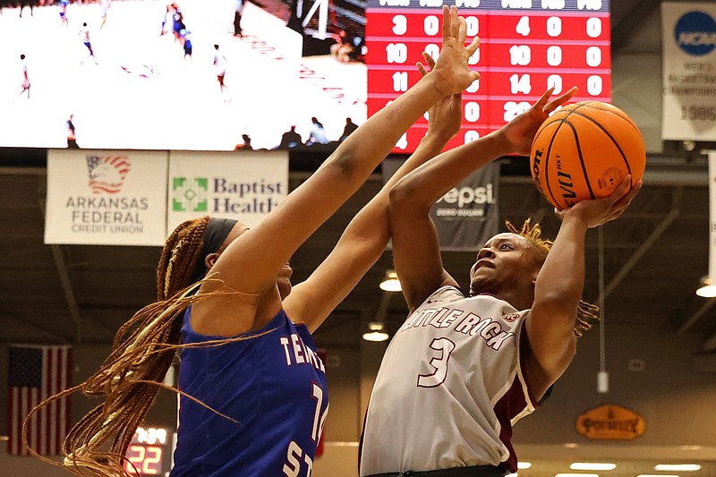 UALR guard Jayla Brooks (right) goes up for a shot over a Tennessee State defender Saturday during the Trojans’ 42-36 victory over the Tigers at the Jack Stephens Center in Little Rock. More photos at arkansasonline.com/122womensbball/.
(Arkansas Democrat-Gazette/Colin Murphey)