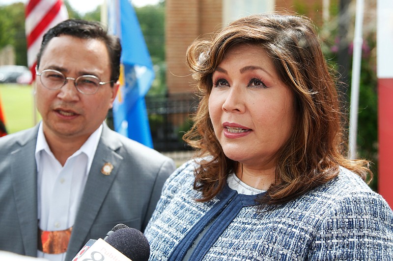 Kimberly Teehee, right, answers a question for the media as Cherokee Nation Principal Chief Chuck Hoskin Jr., left, looks on, following his announcement that he is nominating Teehee as a Cherokee Nation delegate to the U.S. House, in Tahlequah, Okla., Thursday, Aug. 22, 2019. Hoskin Jr. acknowledged the first such attempt by a tribal nation will take time as well as cooperation from Congress. (AP Photo/Sue Ogrocki)