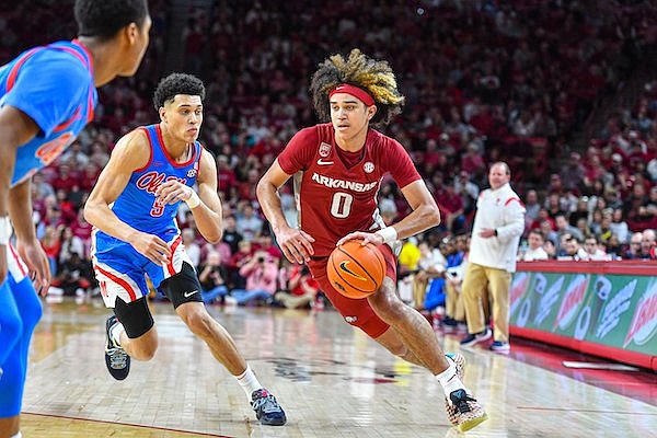 Arkansas guard Anthony Black (0) dribbles during a game against Ole Miss on Saturday, Jan. 21, 2023, in Fayetteville.