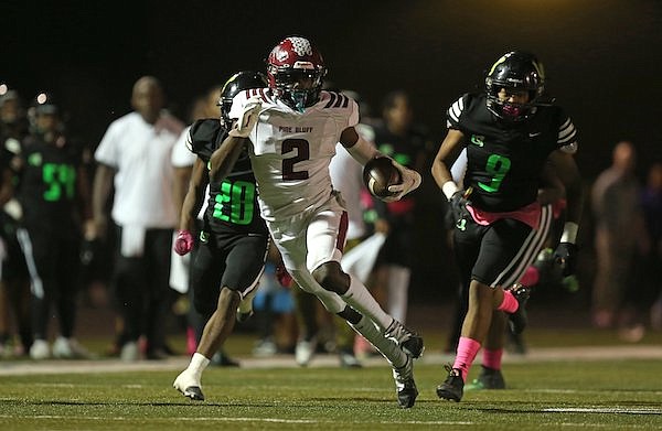 Pine Bluff's Courtney Crutchfield (2) carries the ball during a game against Mills on Friday, Oct. 7, 2022, in Little Rock.