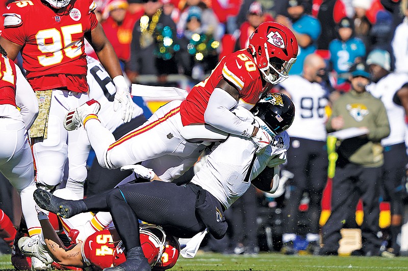 In this Nov. 13, 2022, file photo, Chiefs safety Justin Reid tackles Jaguars running back Travis Etienne Jr. during a game at Arrowhead Stadium in Kansas City. The Chiefs won the game 27-17. (Associated Press)