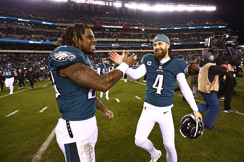 Philadelphia Eagles safety C.J. Gardner-Johnson (23) and kicker Jake Elliott (4) celebrate after defeating the New York Giants 38-7 in an NFL divisional round playoff football game, Saturday, Jan. 21, 2023, in Philadelphia. (AP Photo/Rich Schultz)