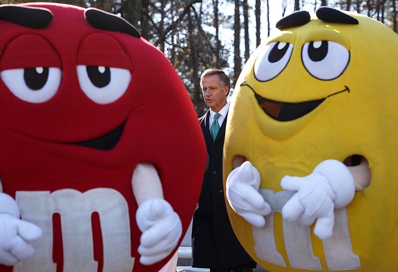 Staff file photo / Former Tennessee Gov. Bill Haslam is framed by workers wearing M&M costumes during a groundbreaking for the Mars Wrigley Confectionery Plant's expansion in 2018. The Cleveland Mars plant produces millions of M&Ms each year and employs more than 575 workers.