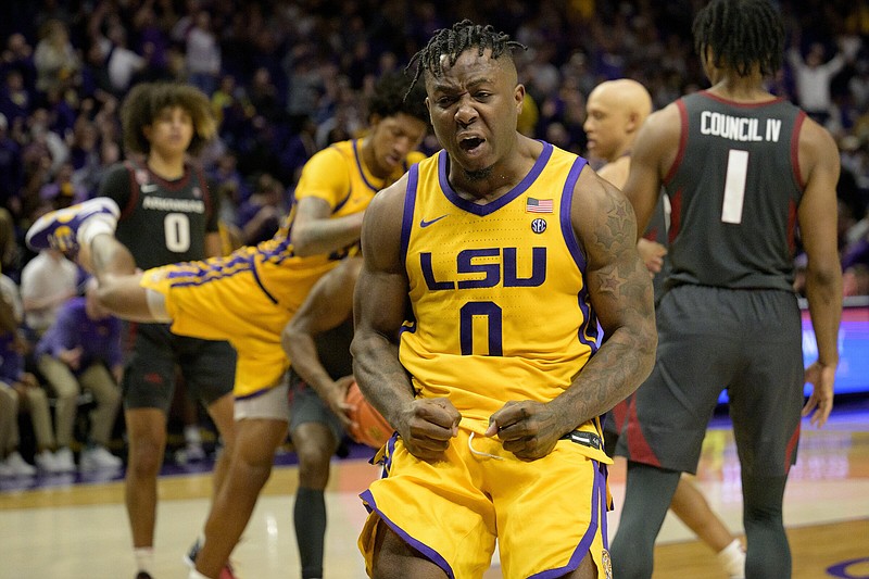LSU guard Trae Hannibal (0) flexes after making a basket in the final minute of the team's NCAA college basketball game against Arkansas in Baton Rouge, La., Wednesday, Dec. 28, 2022. (AP Photo/Matthew Hinton)